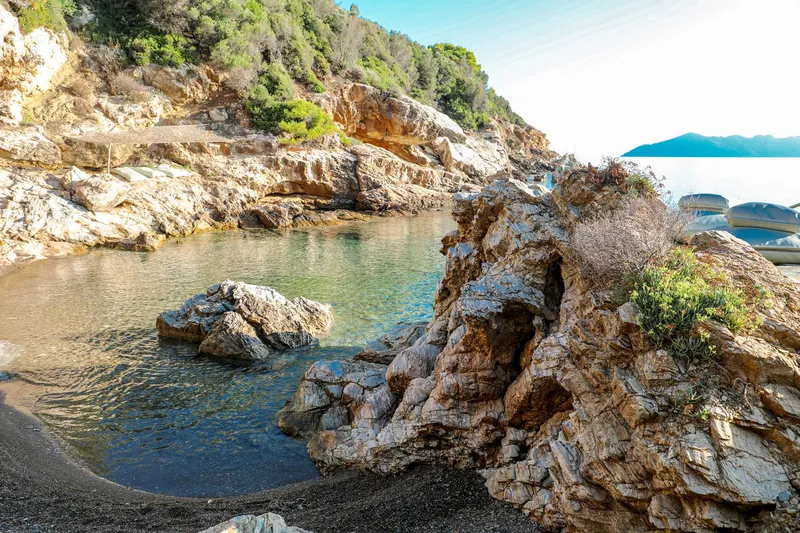 Golden rocks and clear water by the beach