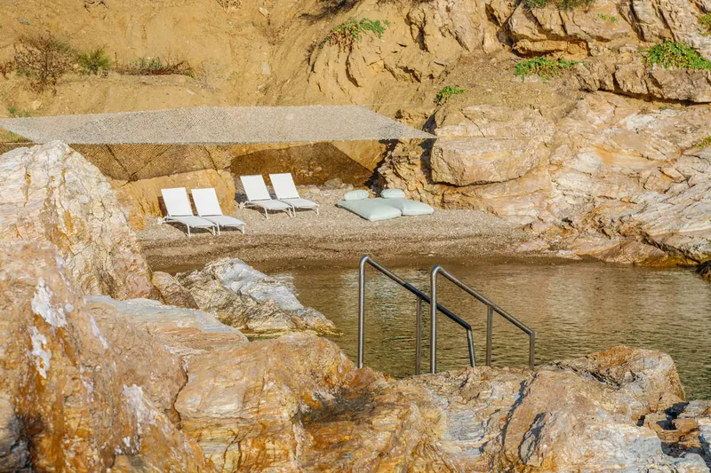 Steps into the sea at the private beach