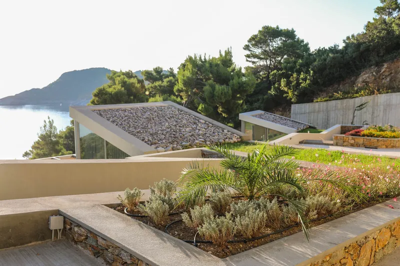 A planted green roof with the sea and the islands beyond