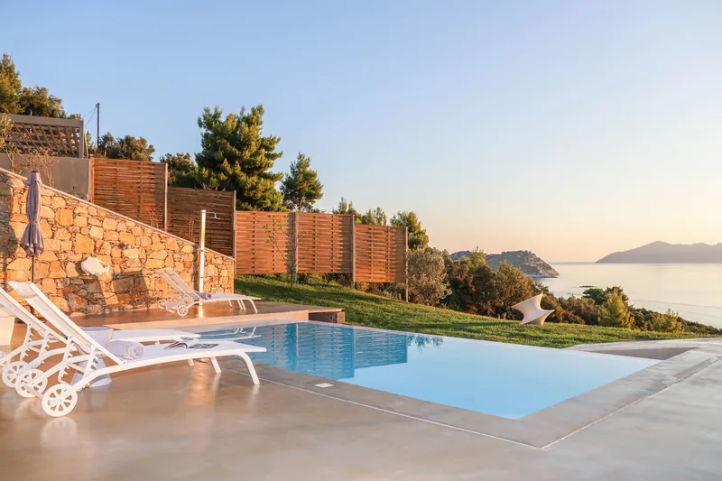 Loungers by the pool in the evening sun