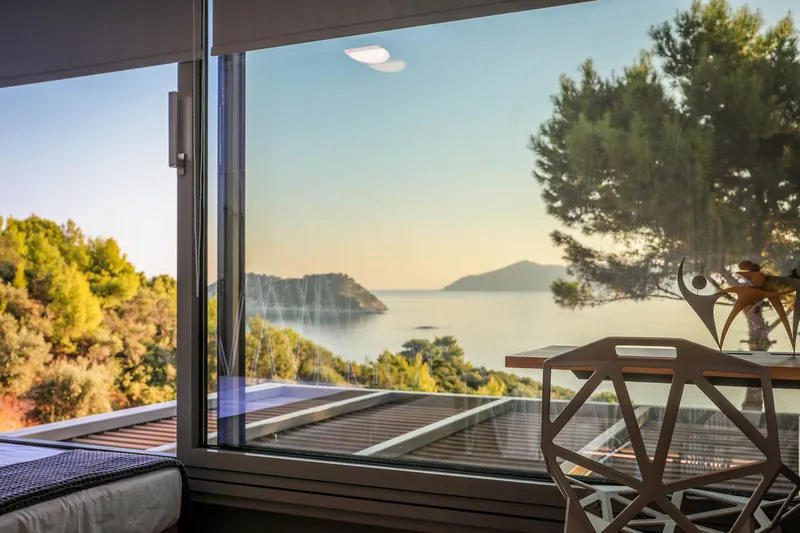The sea and the pines through the window
