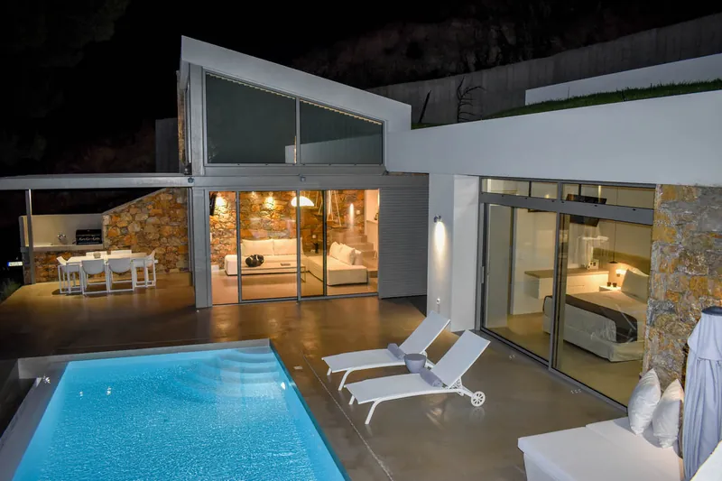 The lit pool and the terrace at night