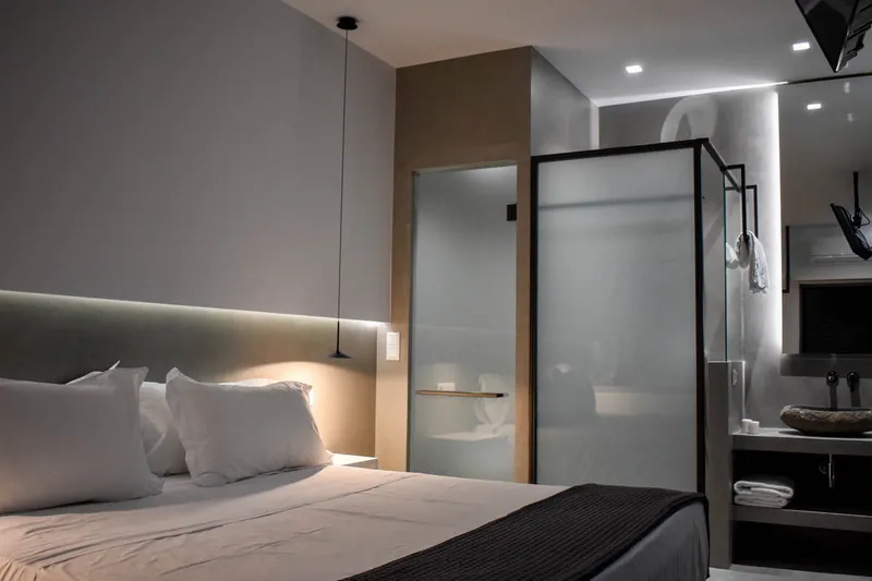 The bedroom and the glass bathroom