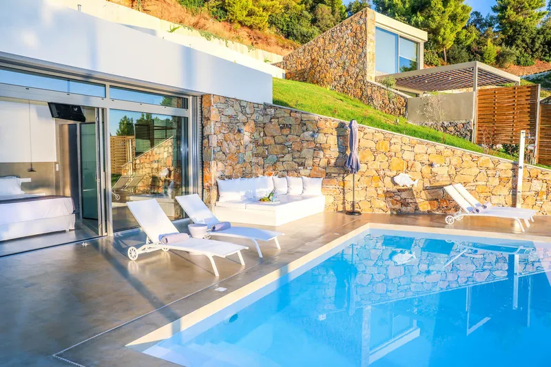 The pool and the terrace by the stone wall