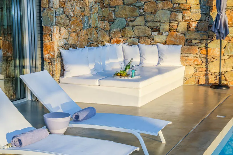 The built-in sofa and loungers by the pool