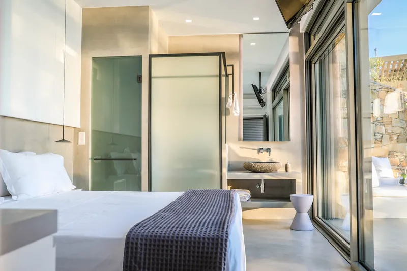 The bedroom opening onto the bathroom