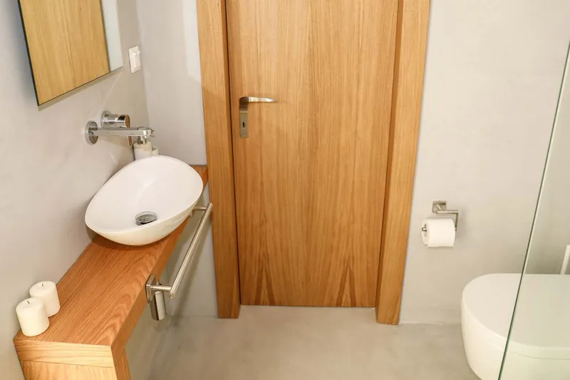 A basin on an oak shelf
