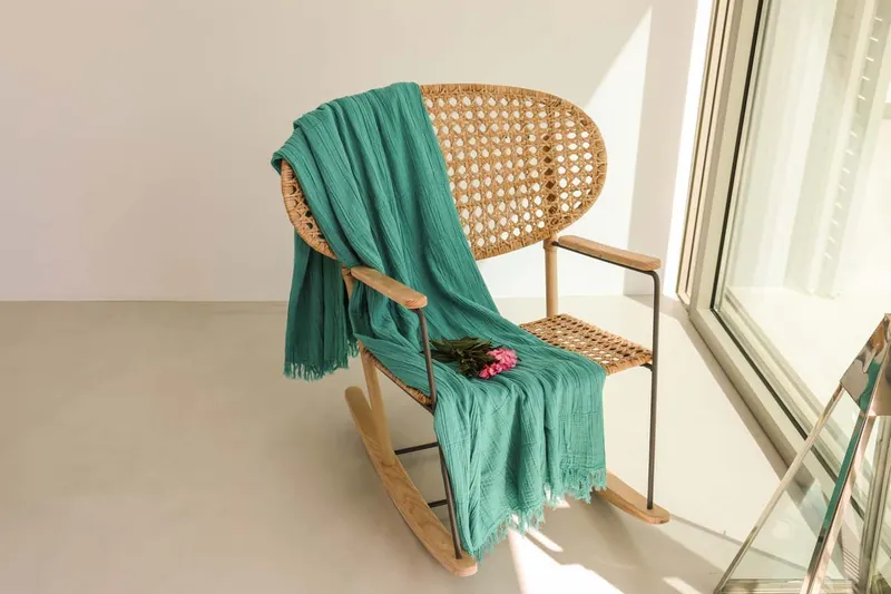 A rocking chair by the window