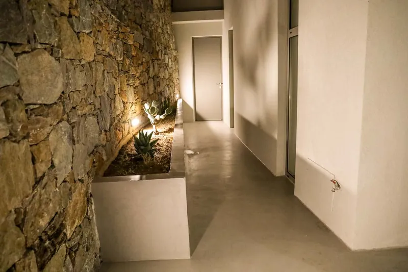 The hallway along the stone wall