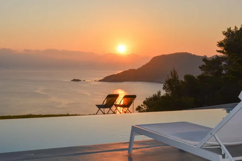 A lounger at sunset above the sea